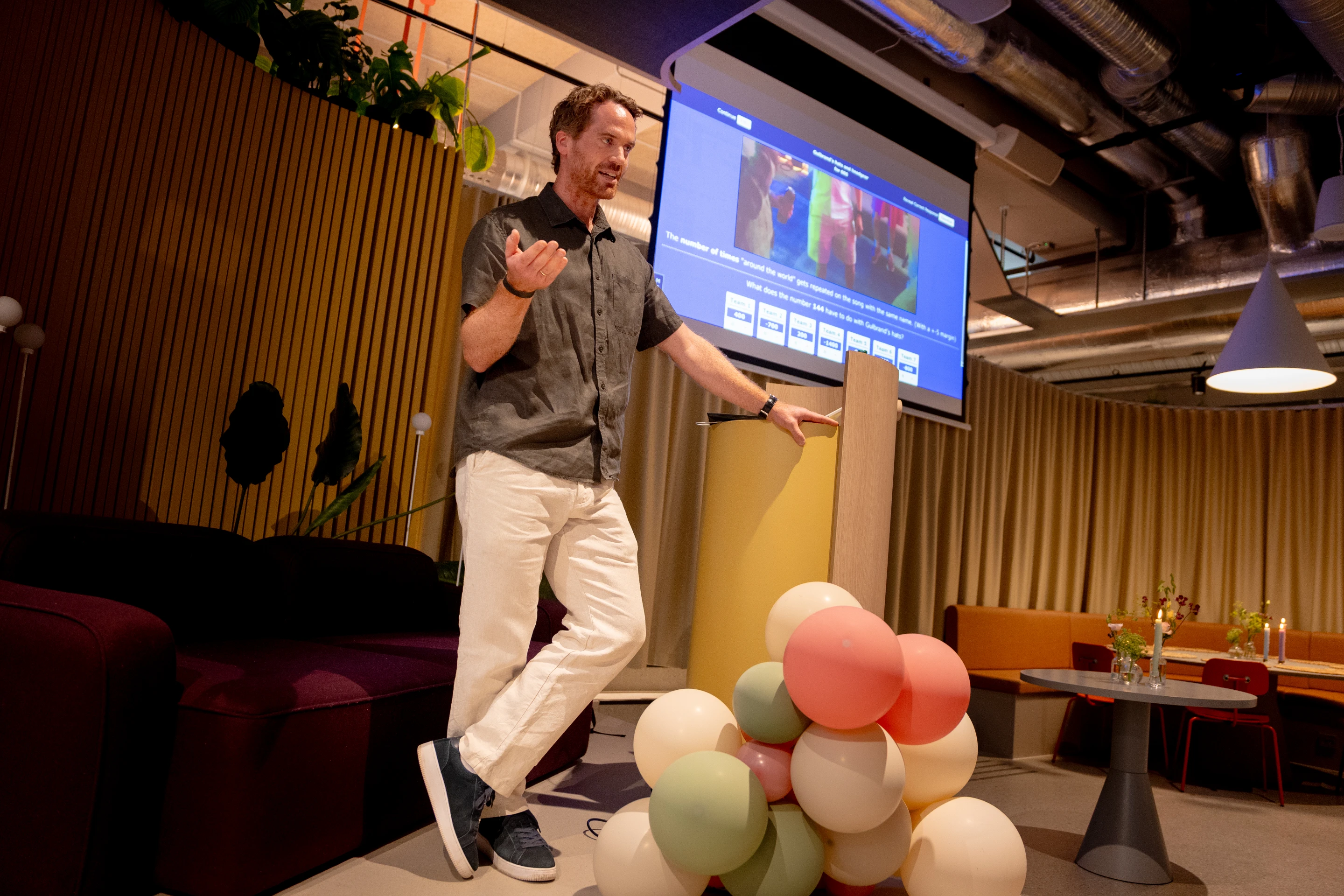 The Oslo team gathered in the lounge area listening to a presentation