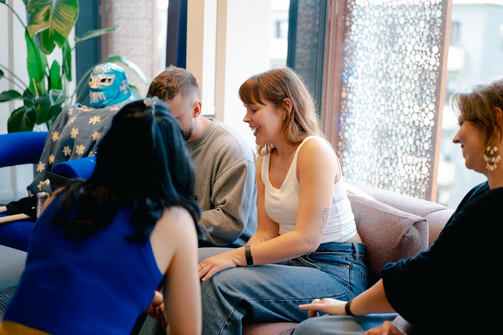 The Oslo team gathered in the lounge area listening to a presentation